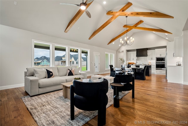 living room with ceiling fan with notable chandelier, hardwood / wood-style floors, sink, high vaulted ceiling, and beamed ceiling