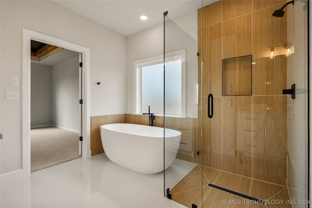 bathroom with tile patterned flooring and plus walk in shower