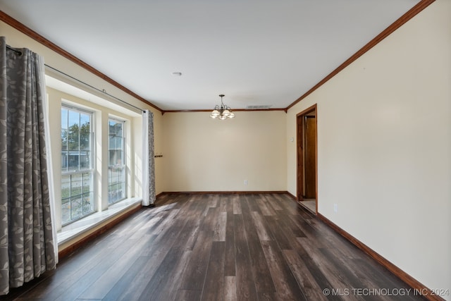 empty room with an inviting chandelier, crown molding, and dark wood-type flooring