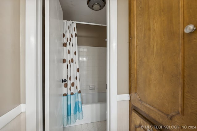 bathroom featuring shower / bath combination with curtain