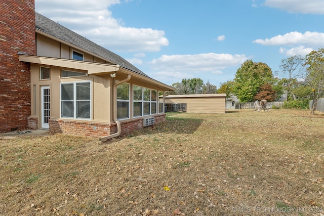 view of yard featuring a sunroom