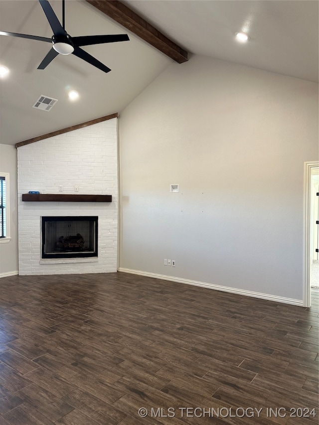 unfurnished living room with a fireplace, vaulted ceiling with beams, dark hardwood / wood-style floors, and ceiling fan