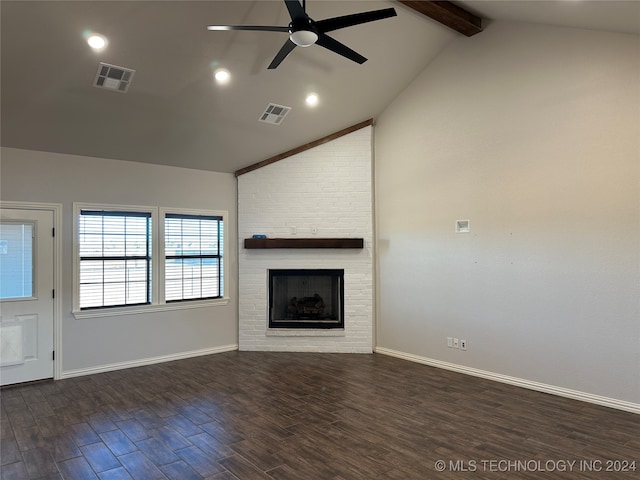 unfurnished living room featuring beam ceiling, dark hardwood / wood-style flooring, a fireplace, high vaulted ceiling, and ceiling fan