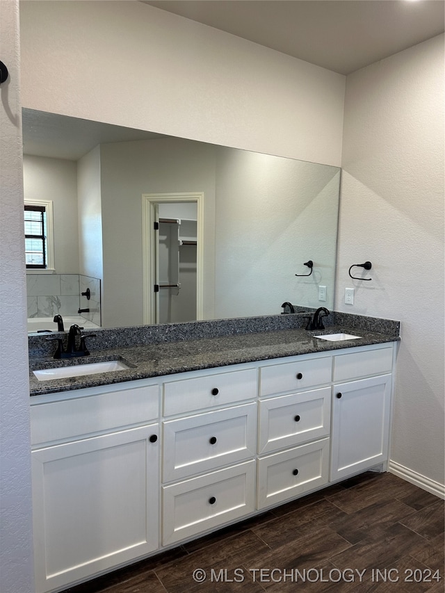 bathroom with vanity and hardwood / wood-style flooring