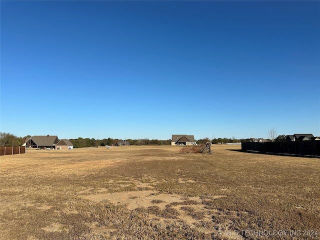 view of yard with a rural view