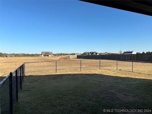 view of yard with a rural view