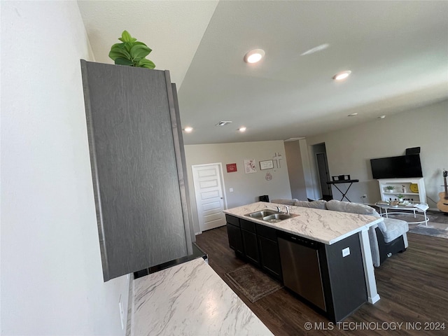 kitchen featuring dishwasher, a center island with sink, dark hardwood / wood-style floors, and sink