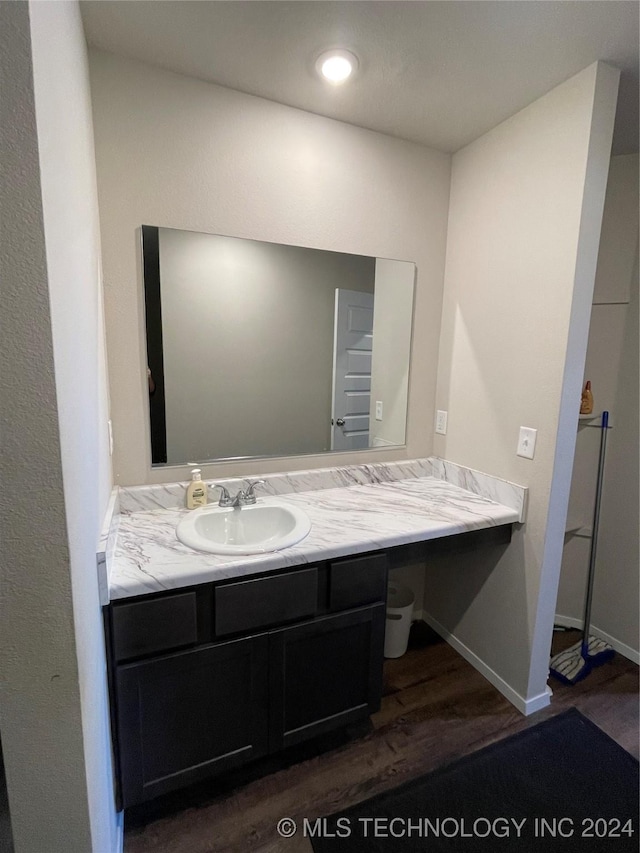 bathroom featuring vanity and wood-type flooring