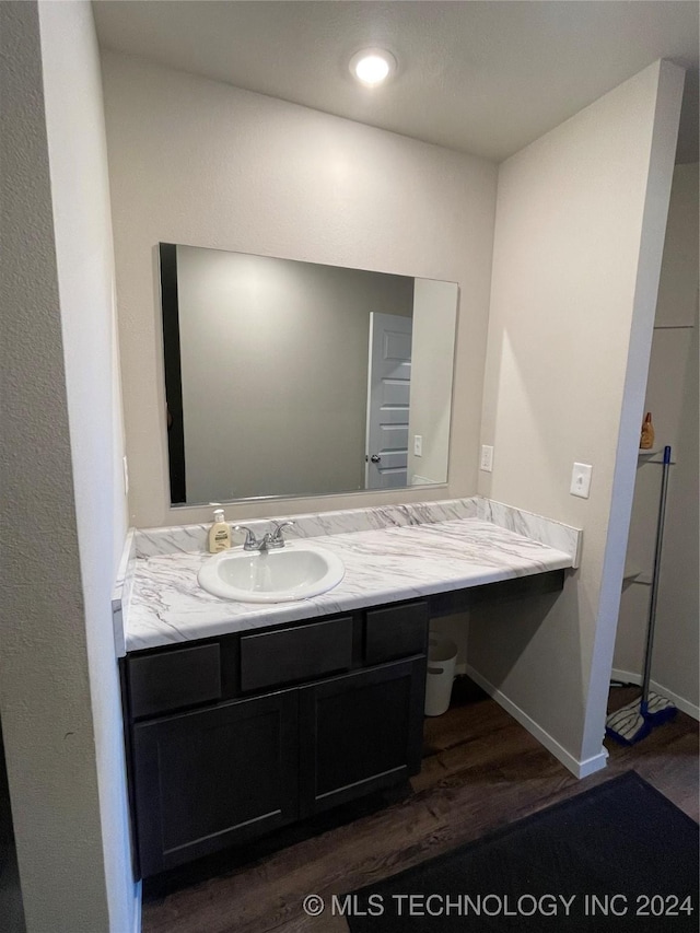 bathroom featuring hardwood / wood-style floors and vanity