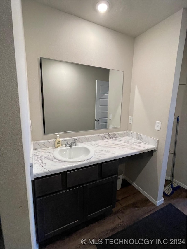 bathroom featuring hardwood / wood-style floors and vanity