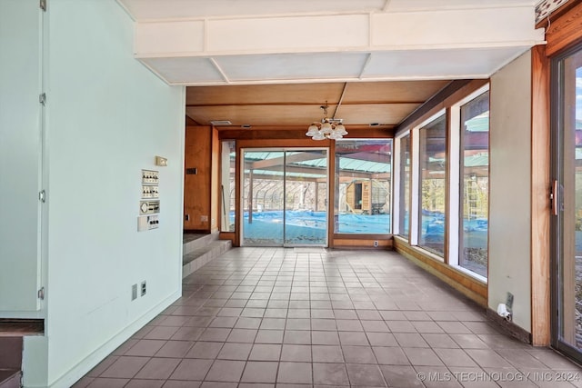 unfurnished sunroom featuring a healthy amount of sunlight