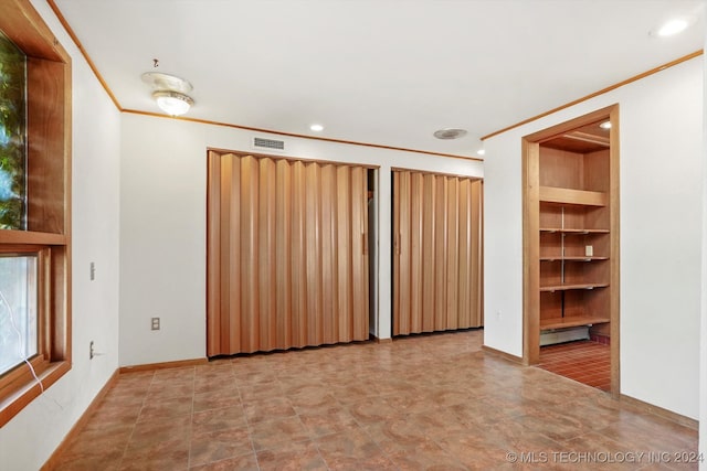 spare room with ornamental molding