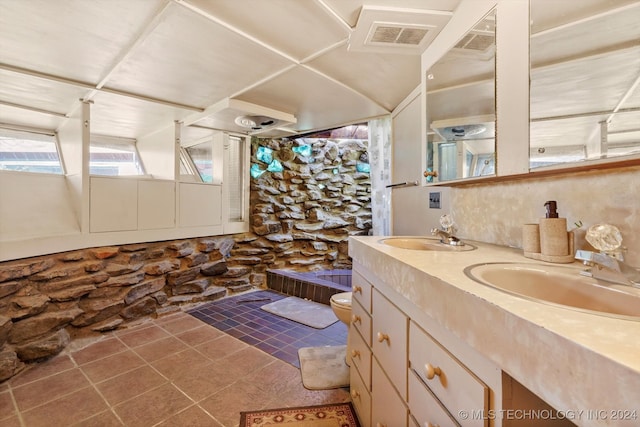 bathroom with vanity, toilet, and tile patterned floors