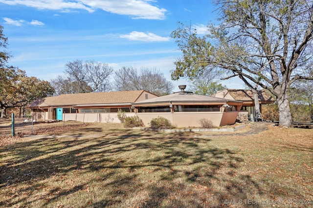 view of home's exterior featuring a lawn