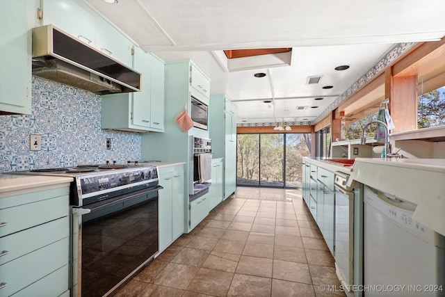 kitchen with a healthy amount of sunlight, dishwasher, stainless steel oven, and high end range oven