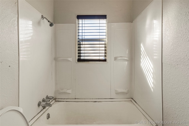 bathroom with toilet and shower / bathtub combination