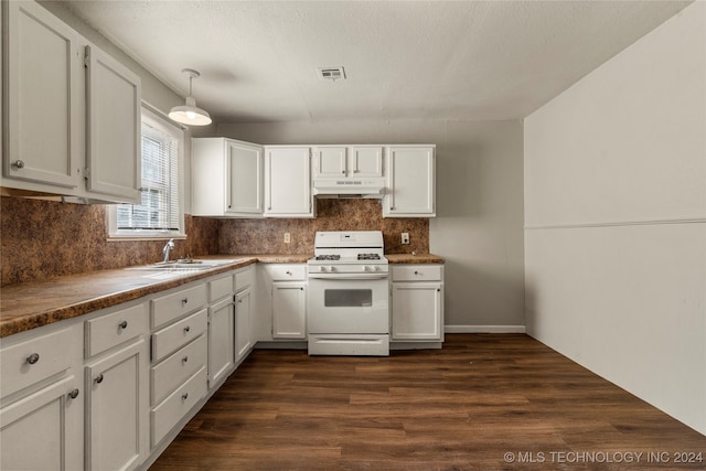 kitchen featuring white gas range, white cabinetry, dark hardwood / wood-style flooring, and hanging light fixtures