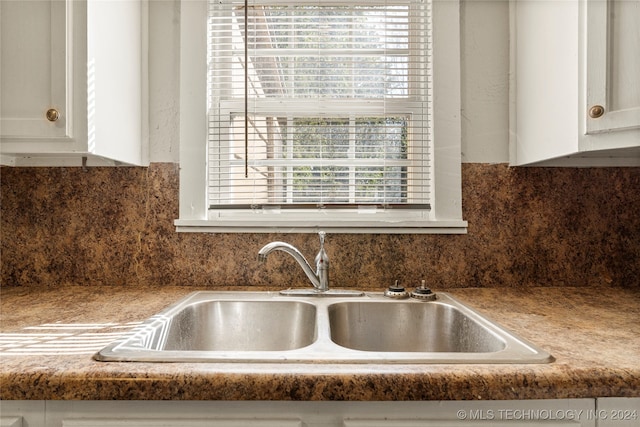 room details with sink and white cabinetry