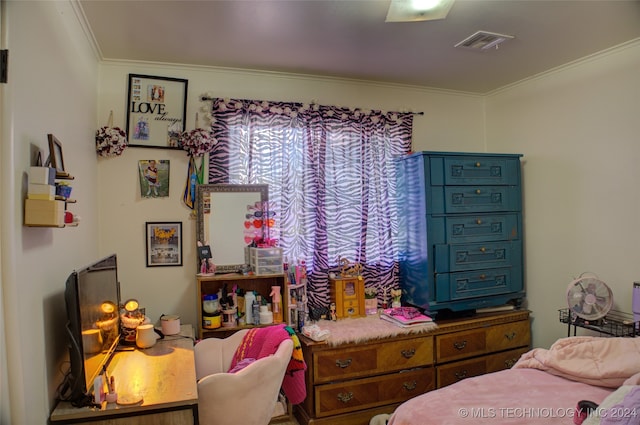 bedroom with ornamental molding