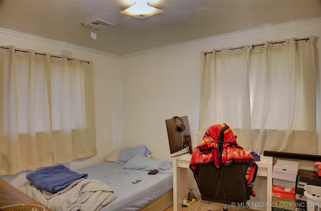 bedroom featuring ornamental molding