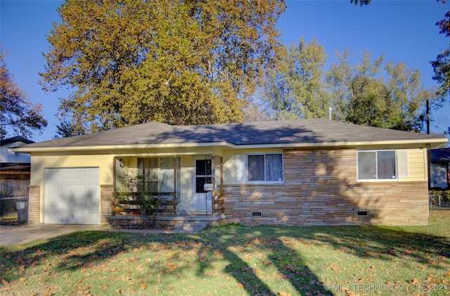 single story home with a garage and a front lawn