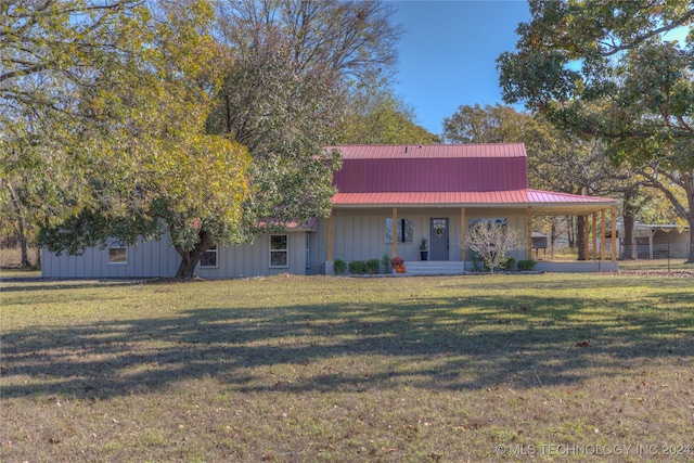 view of front of home with a porch and a front lawn