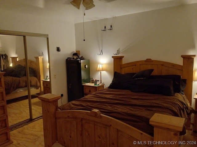 bedroom with a closet, ceiling fan, and light hardwood / wood-style flooring