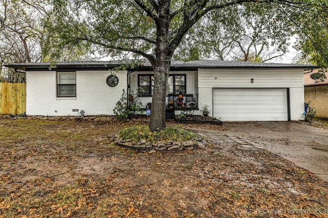 ranch-style home featuring a garage