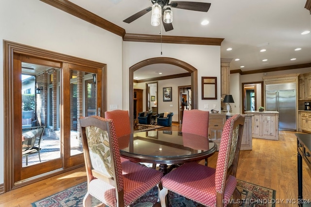 dining area featuring ceiling fan, light hardwood / wood-style floors, and ornamental molding