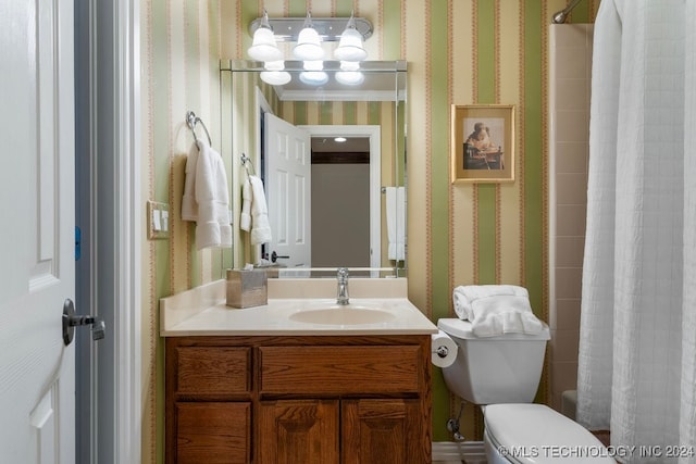 full bathroom featuring shower / tub combo, vanity, and toilet