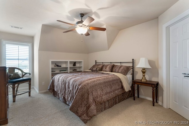 bedroom featuring ceiling fan, light carpet, and lofted ceiling