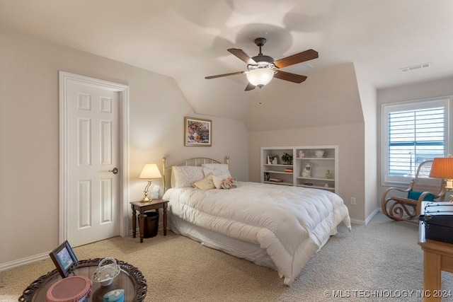 carpeted bedroom with ceiling fan and lofted ceiling