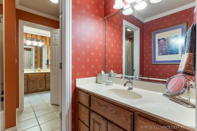 bathroom featuring tile patterned flooring, vanity, and crown molding