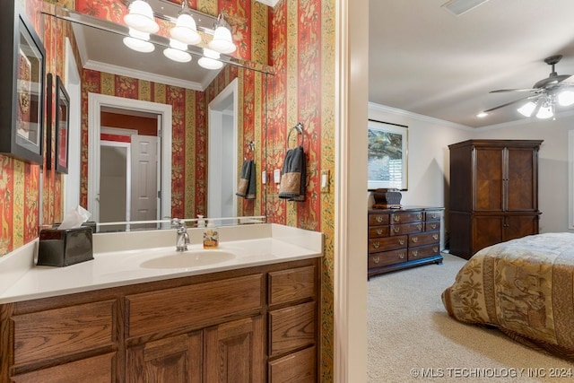 bathroom with vanity, ceiling fan, and crown molding