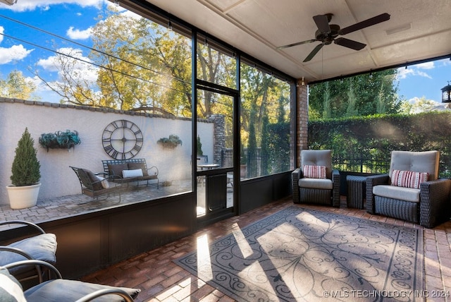 sunroom / solarium with ceiling fan