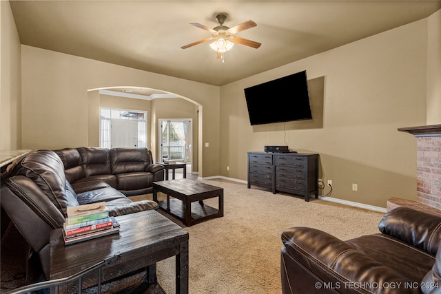 living room featuring carpet and ceiling fan