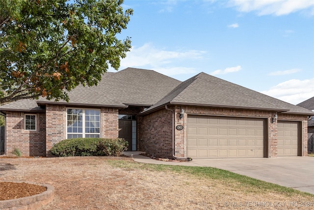 ranch-style home featuring a garage