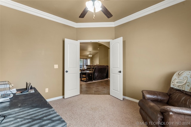 carpeted office space with crown molding and ceiling fan