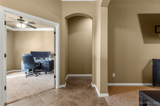 office with crown molding, light tile patterned floors, and ceiling fan