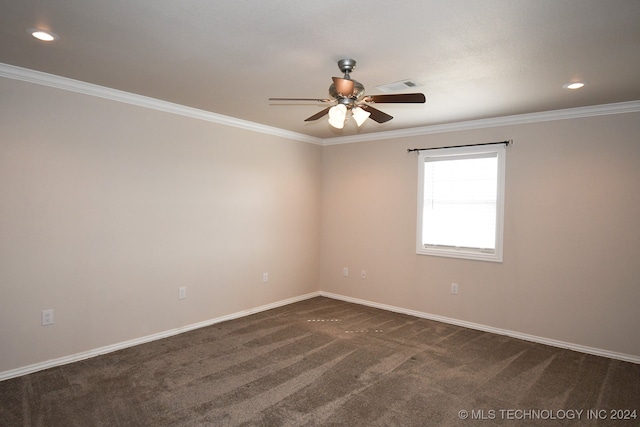 unfurnished room featuring dark carpet, ceiling fan, and crown molding