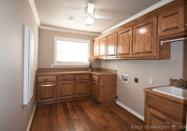 washroom featuring cabinets, hookup for a washing machine, crown molding, electric dryer hookup, and sink