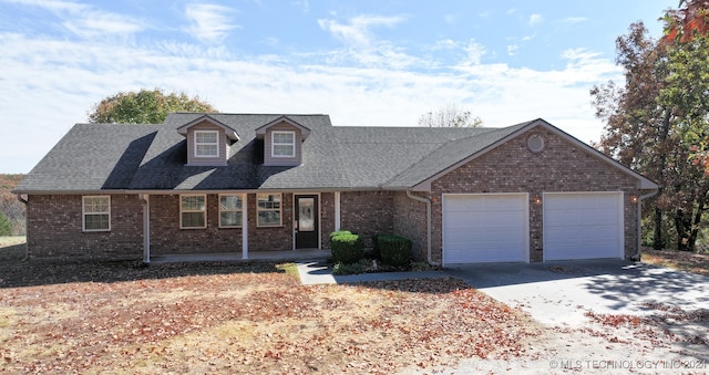 view of front facade featuring a porch and a garage