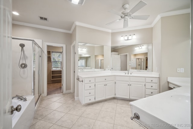 bathroom featuring vanity, crown molding, separate shower and tub, and tile patterned flooring