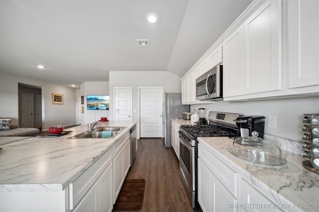 kitchen featuring sink, white cabinets, stainless steel appliances, and dark hardwood / wood-style flooring