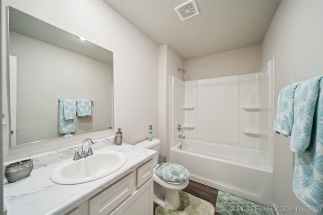 full bathroom featuring vanity, wood-type flooring, toilet, and shower / bathtub combination