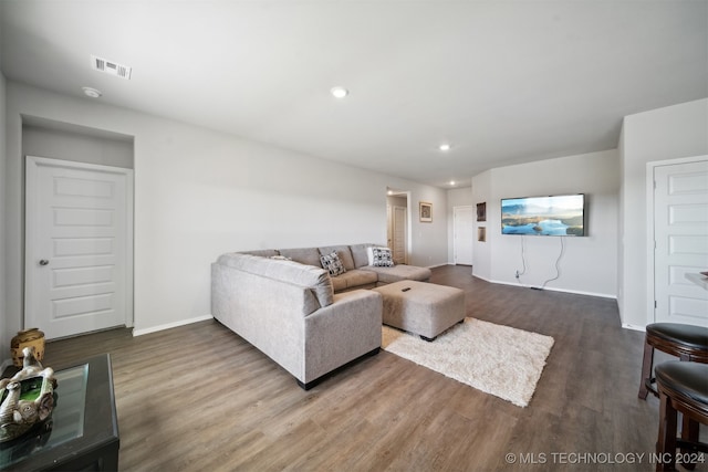 living room with dark hardwood / wood-style floors