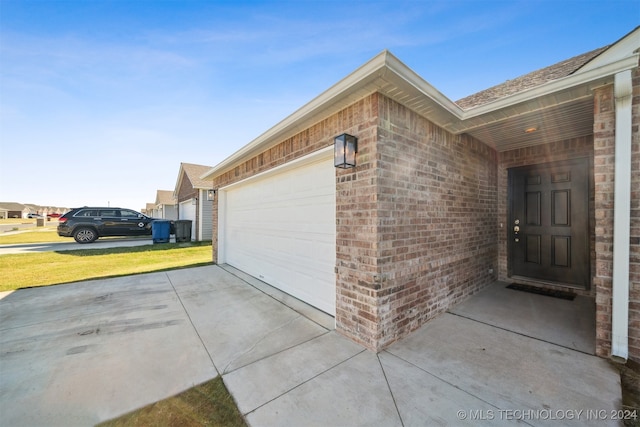 garage featuring a yard