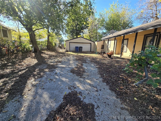 exterior space featuring an outbuilding and a garage