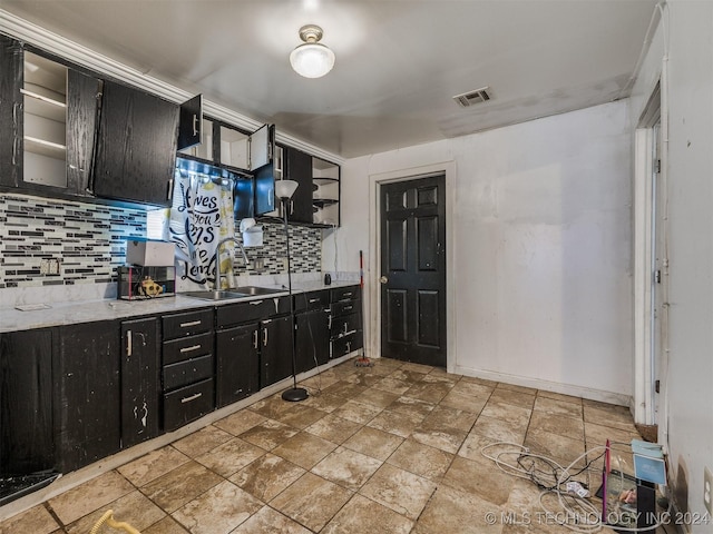 kitchen with decorative backsplash and sink