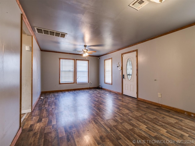 entryway featuring ceiling fan, dark hardwood / wood-style flooring, and crown molding